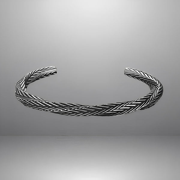 Product shot of a minimalist bangle bracelet made from durable aluminum alloy, featuring an adjustable clasp and unique geometric engraving, displayed against a plain background.
